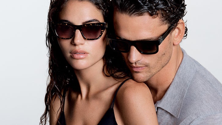 Female and male models wearing Calvin Klein sunglasses