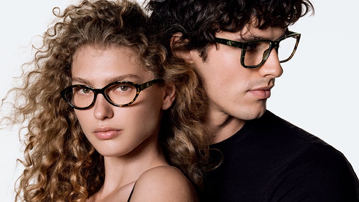 Female and male models wearing Calvin Klein Jeans eyeglasses