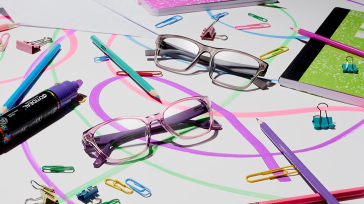Two pairs of clear Converse eyeglasses on a colorful background