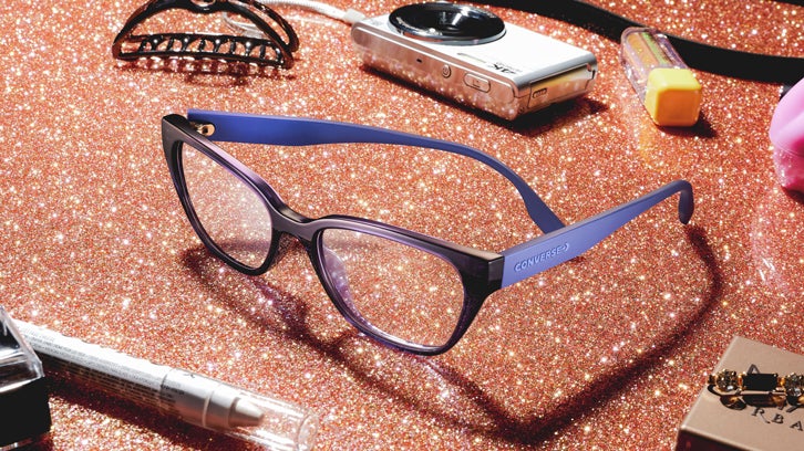 Dark blue Converse eyeglasses on a sparkly background