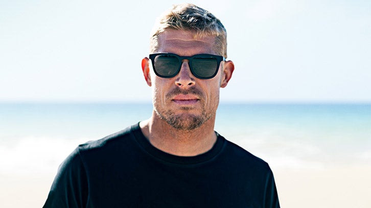 Model wearing black Dragon Sunglasses.